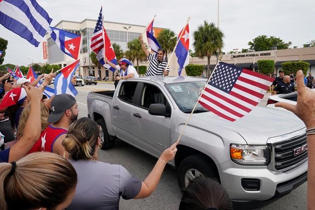Cuban exiles rally at Versailles Restaurant in Miami's Little Havana neighborhood in support of protesters in Cuba, Monday, July 12, 2021, in Miami. Sunday's protests in Cuba marked some of the biggest displays of antigovernment sentiment in the tightly controlled country in years. (AP Photo/Marta Lavandier)