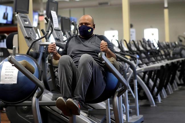 Earl Edwards, of Canton, Mass., works out on Monday, July 6, 2020, at Answer is Fitness gym, in Canton. THE CANADIAN PRESS/AP, Steven Senne