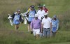 England's Lee Westwood, front left gestures talks to United States' Dustin Johnson on the 16th fairway during a practice round for the British Open Golf Championship at Royal St George's golf course Sandwich, England, Tuesday, July 13, 2021. The Open starts Thursday, July, 15. (AP Photo/Ian Walton)