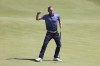 Germany's Marcel Siem celebrates after making a birdie putt on the 18th green during the second round of the British Open Golf Championship at Royal St George's golf course Sandwich, England, Friday, July 16, 2021. (AP Photo/Ian Walton)
