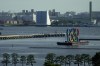 The Olympic Rings float on a barge at Odaiba Marine Park as Tokyo prepares for the 2020 Summer Olympics, Friday, July 16, 2021. The pandemic-delayed games open on July 23 without spectators at most venues. (AP Photo/Charlie Riedel)