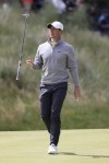 Northern Ireland's Rory McIlroy catches his club on the 2nd green during the second round of the British Open Golf Championship at Royal St George's golf course Sandwich, England, Friday, July 16, 2021. (AP Photo/Ian Walton)