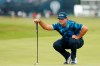 United States' Patrick Reed looks at the line of his putt on the 1st green during the first round British Open Golf Championship at Royal St George's golf course Sandwich, England, Thursday, July 15, 2021. (AP Photo/Peter Morrison)
