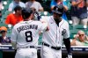 Detroit Tigers right fielder Robbie Grossman is greeted by Jonathan Schoop after hitting a solo home run during the first inning of the first baseball game of a doubleheader against the Minnesota Twins, Saturday, July 17, 2021, in Detroit. (AP Photo/Carlos Osorio)