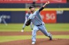 Toronto Blue Jays starting pitcher Hyun Jin Ryu throws to a Texas Rangers batter during the first inning of the first baseball game of a doubleheader in Buffalo, N.Y., Sunday, July 18, 2021. (AP Photo/Adrian Kraus)