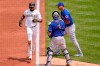 Pittsburgh Pirates' Gregory Polanco, left, scores past New York Mets starting pitcher Taijuan Walker, right, and catcher Tomas Nido on an infield hit by Kevin Newman and a fielding error during the first inning of a baseball game in Pittsburgh, Sunday, July 18, 2021. Three runs scored on the fielding error by Walker. (AP Photo/Gene J. Puskar)