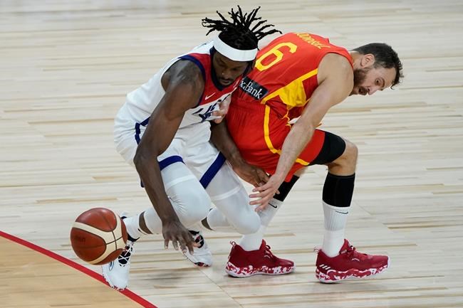 United States' Jerami Grant, left, and Spain's Sergio Rodriguez (6) battle for the ball during the second half of an exhibition basketball game in preparation for the Olympics, Sunday, July 18, 2021, in Las Vegas. (AP Photo/John Locher)