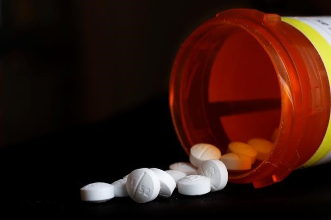 FILE - This Aug. 29, 2018, file photo shows an arrangement of Oxycodone pills in New York. The three biggest U.S. drug distribution companies and the drugmaker Johnson & Johnson are on the verge of a $26 billion settlement covering thousands of lawsuits over the toll of opioids across the U.S., two people with knowledge of the plans told The Associated Press. The settlement involving AmerisourceBergen, Cardinal Health and McKesson is expected this week. A $1 billion-plus deal involving the three distributors and the state of New York was planned for Tuesday, July 20, 2021. (AP Photo/Mark Lennihan, File)