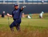 Ireland's Shane Lowry gestures after playing out of the rough on the 1st fairway the first round British Open Golf Championship at Royal St George's golf course Sandwich, England, Thursday, July 15, 2021. (AP Photo/Peter Morrison)