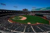 Fans watch as Oakland Athletics' James Kaprielian pitches against the Los Angeles Angels during the sixth inning of a baseball game in Oakland, Calif., Tuesday, July 20, 2021. (AP Photo/Jeff Chiu)
