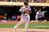 Oakland Athletics' Matt Olson watches his RBI single against the Los Angeles Angels during the seventh inning of a baseball game in Oakland, Calif., Tuesday, July 20, 2021. (AP Photo/Jeff Chiu)