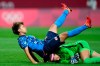 Japan's Mina Tanaka (11) collides with Canada's goalkeeper Stephanie Labbe (1) during a women's soccer match at the 2020 Summer Olympics, Wednesday, July 21, 2021, in Sapporo, Japan. THE CANADIAN PRESS/AP/Silvia Izquierdo