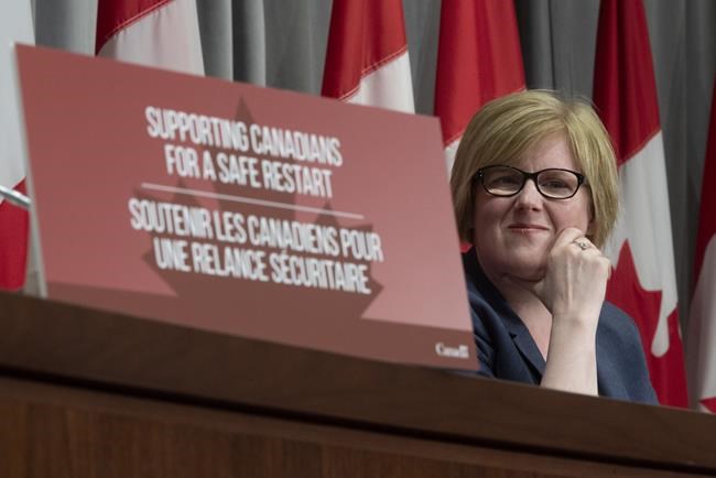 Employment, Workforce Development and Disability Inclusion Minister Carla Qualtrough listens to a question during a news conference Thursday August 20, 2020 in Ottawa. THE CANADIAN PRESS/Adrian Wyld