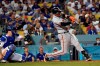 San Francisco Giants' Wilmer Flores connects for a two-run home run during the ninth inning of the team's baseball game against the Los Angeles Dodgers on Wednesday, July 21, 2021, in Los Angeles. (AP Photo/Marcio Jose Sanchez)