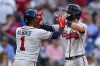 Atlanta Braves' Dansby Swanson, right, celebrates with Ozzie Albies after hitting a grand slam during the third inning of the team's baseball game against the Philadelphia Phillies, Thursday, July 22, 2021, in Philadelphia. (AP Photo/Chris Szagola)