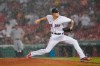 Boston Red Sox starting pitcher Tanner Houck delivers to the New York Yankees during a rain shower in the fifth inning of a baseball game at Fenway Park, Thursday, July 22, 2021, in Boston. (AP Photo/Elise Amendola)