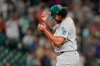 Oakland Athletics starting pitcher Sean Manaea pauses after he gave up a solo home run to Seattle Mariners' Tom Murphy during the seventh inning of a baseball game Thursday, July 22, 2021, in Seattle. (AP Photo/Ted S. Warren)