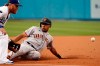 San Francisco Giants' LaMonte Wade Jr., right, steals third base next to Los Angeles Dodgers third baseman Justin Turner during the first inning of a baseball game Thursday, July 22, 2021, in Los Angeles. (AP Photo/Marcio Jose Sanchez)