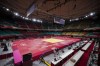 People prepare the field of play for judo at the Nippon Budokan ahead of the 2020 Summer Olympics, Friday, July 23, 2021, in Tokyo, Japan. (AP Photo/Vincent Thian)