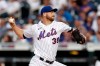 New York Mets pitcher Tylor Megill throws to a Toronto Blue Jays batter during the third inning of a baseball game Friday, July 23, 2021, in New York. (AP Photo/Adam Hunger)