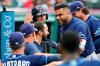 Tampa Bay Rays' Nelson Cruz is congratulated by teammates after hitting a solo home run during the third inning of the teams' baseball game against the Cleveland Indians, Friday, July 23, 2021, in Cleveland. (AP Photo/Tony Dejak)