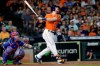 Houston Astros' Kyle Tucker, right, watches his three-run home run hit in front of Texas Rangers catcher Jonah Heim, left, during the third inning of a baseball game Friday, July 23, 2021, in Houston. (AP Photo/Michael Wyke)