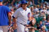Chicago Cubs relief pitcher Andrew Chafin, right, walks to the dugout after turning the ball over to manager David Ross during the seventh inning of a baseball game against the Arizona Diamondbacks in Chicago, Saturday, July 24, 2021. (AP Photo/Nam Y. Huh)
