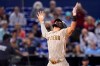San Diego Padres' Fernando Tatis Jr. reacts as he crosses the plate with a solo home run during the first inning of a baseball game against the Miami Marlins, Saturday, July 24, 2021, in Miami. (AP Photo/Lynne Sladky)