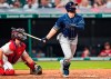 Tampa Bay Rays' Austin Meadows watches his two-run home run next to Cleveland Indians catcher Austin Hedges in the ninth inning of a baseball game Saturday, July 24, 2021, in Cleveland. (AP Photo/Tony Dejak)