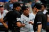 Chicago White Sox's Tony La Russa, center, reacts as he talks with umpires during the fifth inning of a baseball game against the Milwaukee Brewers, Saturday, July 24, 2021, in Milwaukee. (AP Photo/Aaron Gash)