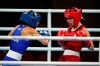 Canada's Mandy Bujold, right, exchanges punches with Serbia's Nina Radovanovic during their women's flyweight 51-kg boxing match at the 2020 Summer Olympics, Saturday, July 24, 2021, in Tokyo, Japan. (AP Photo/Frank Franklin II)