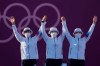 From left first placed South Korea's An San, Jang Minhee, and Kang Chaeyoung celebrate on the podium during the medal ceremony of the women's team competition at the 2020 Summer Olympics, Sunday, July 25, 2021, in Tokyo, Japan. (AP Photo/Alessandra Tarantino)