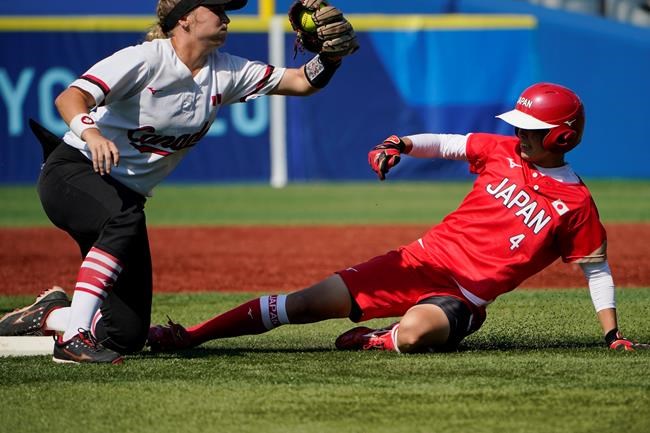 Japan's Yuka Ichiguchi, right, steals second base under the tag of Canada's Kelsey Harshman, left, in a softball game in Yokohama Baseball Stadium, at the 2020 Summer Olympics, Sunday, July 25, 2021, in Yokohama, Japan. THE CANADIAN PRESS/AP/Sue Ogrocki