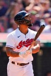 Cleveland Indians' Bobby Bradley watches his sacrifice fly in the eighth inning of a baseball game against the Tampa Bay Rays, Sunday, July 25, 2021, in Cleveland. Indians' Amed Rosario scored on the play. (AP Photo/Tony Dejak)