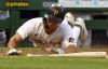 Pittsburgh Pirates' Adam Frazier scores against the Atlanta Braves during the third inning of a baseball game Tuesday, July 6, 2021, in Pittsburgh. (Matt Freed/Pittsburgh Post-Gazette via AP)
