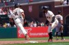San Francisco Giants' LaMonte Wade Jr, left, reacts toward first base coach Antoan Richardson after hitting a home run against the Pittsburgh Pirates during the third inning of a baseball game in San Francisco, Sunday, July 25, 2021. (AP Photo/Jeff Chiu)