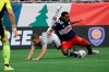 New England Revolution defender Jon Bell (23) clears the ball from the box ahead of CF Montreal midfielder Djordje Mihailovic (8) during the first half of an MLS soccer match, Sunday, July 25, 2021, in Foxborough, Mass. (AP Photo/Mary Schwalm)