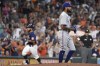 Texas Rangers starting pitcher Dennis Santana, right, walks away as Houston Astros' Abraham Toro, back left, rounds the bases after hitting a two-run home run during the fifth inning of a baseball game, Sunday, July 25, 2021, in Houston. (AP Photo/Eric Christian Smith)