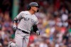 New York Yankees' Gleyber Torres runs to first after hitting an RBI-single in the eighth inning of a baseball game against the Boston Red Sox, Sunday, July 25, 2021, in Boston. (AP Photo/Steven Senne)