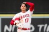 Los Angeles Angels' Shohei Ohtani runs his fingers through his hair after stealing second during the first inning of a baseball game against the Colorado Rockies Monday, July 26, 2021, in Anaheim, Calif. (AP Photo/Mark J. Terrill)