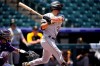 Pittsburgh Pirates' Adam Frazier triples off Colorado Rockies starting pitcher Jon Gray in the first inning of a baseball game Wednesday, June 30, 2021, in Denver. (AP Photo/David Zalubowski)