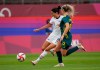 United States' Christen Press, left, is challenged by Australia's Ellie Carpenter during a women's soccer match at the 2020 Summer Olympics, Tuesday, July 27, 2021, in Kashima, Japan. (AP Photo/Fernando Vergara)