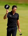 Norway's Viktor Hovland acknowledges the crowd on the 18th green during the final round of the British Open Golf Championship at Royal St George's golf course Sandwich, England, Sunday, July 18, 2021. (AP Photo/Alastair Grant)