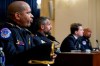 From left, U.S. Capitol Police Sgt. Aquilino Gonell, Washington Metropolitan Police Department officer Michael Fanone, Washington Metropolitan Police Department officer Daniel Hodges and U.S. Capitol Police Sgt. Harry Dunn watch a video of the rioters during the House select committee hearing on the Jan. 6 attack on Capitol Hill in Washington, Tuesday, July 27, 2021. (AP Photo/ Andrew Harnik, Pool)