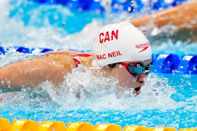 Margaret Mac Neil, of Canada, competes in the women's 100m butterfly semifinal during the Tokyo Olympics in Tokyo, Japan on Sunday, July 25, 2021. THE CANADIAN PRESS/Frank Gunn