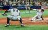New York Yankees' Aaron Judge (99) watches as Greg Allen, right, scores on a DJ LeMahieu's RBI single off Tampa Bay Rays starter Shane McClanahan during the fifth inning of a baseball game Tuesday, July 27, 2021, in St. Petersburg, Fla. (AP Photo/Steve Nesius)