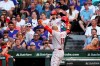 Cincinnati Reds' Joey Votto gestures while returning to the dugout after hitting a home run against the Chicago Cubs during the third inning of a baseball game Tuesday, July 27, 2021, in Chicago. (AP Photo/David Banks)