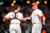 San Francisco Giants catcher Buster Posey, left, celebrates with pitcher Jake McGee after the Giants defeated the Los Angeles Dodgers 2-1 in a baseball game in San Francisco, Tuesday, July 27, 2021. (AP Photo/Jeff Chiu)