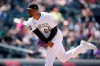 Colorado Rockies relief pitcher Mychal Givens works against the Seattle Mariners in the seventh inning of a baseball game Wednesday, July 21, 2021, in Denver. (AP Photo/David Zalubowski)