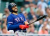 Texas Rangers' Joey Gallo reacts after hitting a fly ball for an out during the fourth inning of a baseball game against the Detroit Tigers, Monday, July 19, 2021, in Detroit. (AP Photo/Duane Burleson)